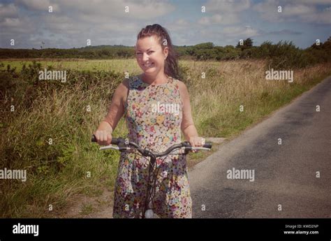 Mature Female Cycling In The Countryside On A Summers Day John Gollop Stock Photo Alamy