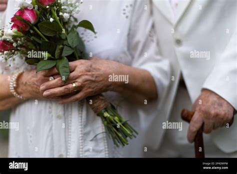 Older hands and wedding rings hi-res stock photography and images - Alamy