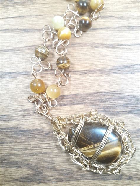 Tiger S Eye Pendant Necklace With Gold Color Chain And Wirework Brown