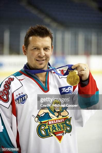 Former Nhl Ice Hockey Player Theo Fleury With His Olympic Gold Medal