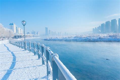 Fog on Songhua River and Tall Buildings in Fog on Both Sides of the River after Snow in Jilin ...