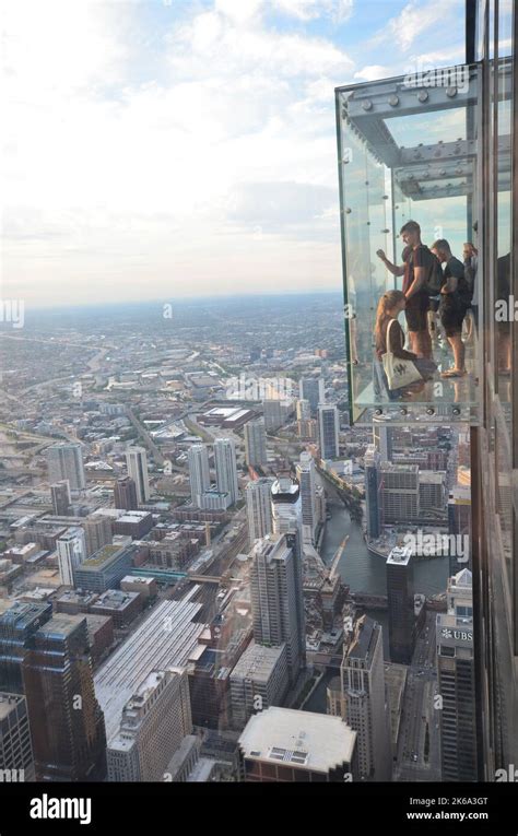 Chicago, Illinois, USA - August 13, 2015: people standing in a glass ...