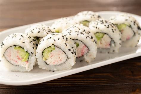 Maki California Sushi With Surimi Crab Cucumber And Sesame Seeds On