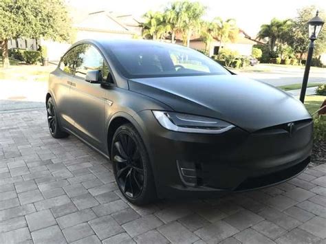 Tesla Model X Black Satin Gold Dust Vinyl Wrap With Carbon Fiber