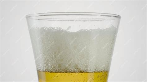 Premium Photo Closeup Of Beer In Clear Glass On White Background