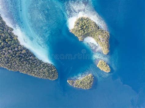 Aerial Of Tropical Islands And Coral Reefs In Raja Ampat Stock Image