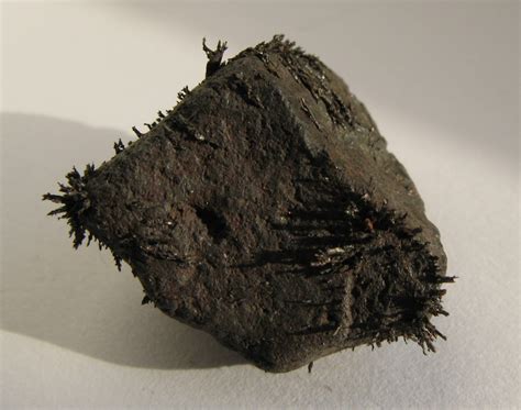 File:Magnetite with iron shavings.jpg - Wikimedia Commons