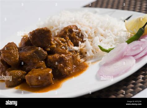 Close-up of mutton curry served with rice Stock Photo - Alamy