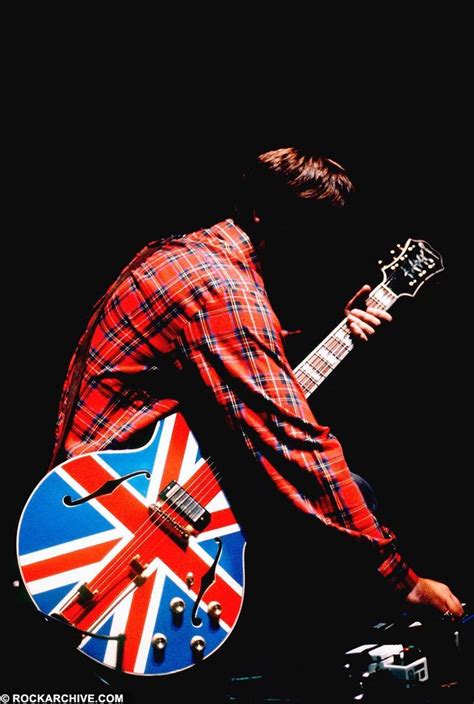 Noel Gallagher Of Oasis With His Iconic Union Jack Guitar