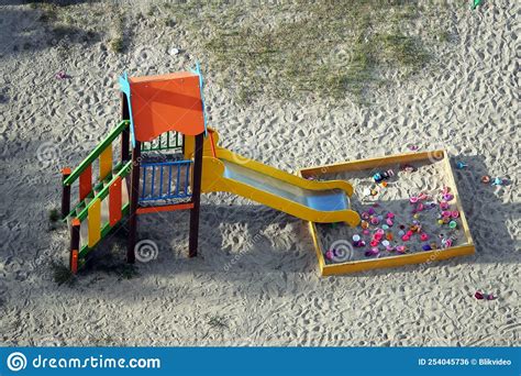 Playground slide with toys stock photo. Image of quarter - 254045736