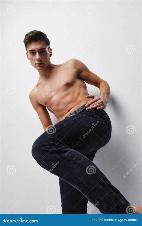 A Man In Trousers With A Raised Leg And A Naked Torso Bottom View Stock Photo Image Of
