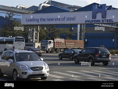 Cars Pass A Factory Of Hyundai Steel Just Opposite The Large South