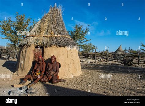 Himba Women In Front Of Their Hut Kaokoland Namibia Africa Stock