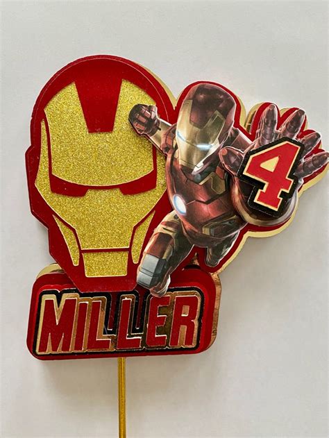 An Iron Man Cake Topper With The Number 4 On It S Sticker