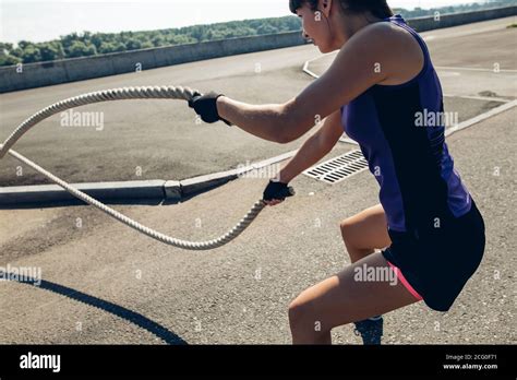 Battling Ropes Woman Outdoor Workout Exercise Fitted Body Stock Photo