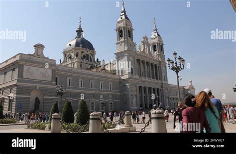 Tourists Visiting The Famous Cathedral Of Nuestra Senora De Almudena In