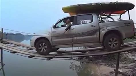 Boat-Towing Pickup Truck Makes a Nerve Wracking Trip Across Water on a ...