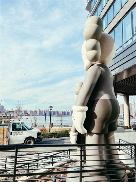 KAWS sculpture standing at the entrance of a luxury residence | KAWS ...