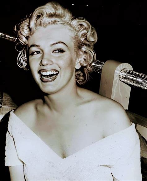 A Black And White Photo Of A Woman Smiling