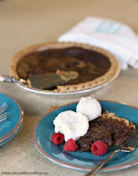 Two Plates With Pie And Whipped Cream On Them One Has Raspberries In It