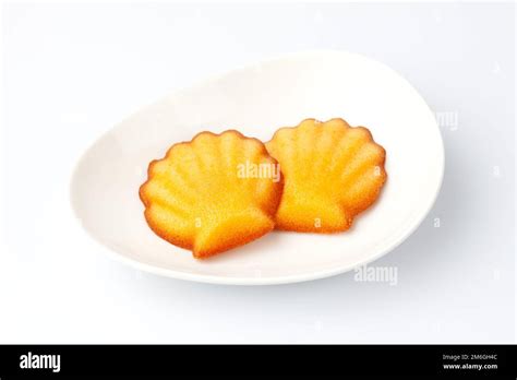 madeleine french pastry isolated on white background Stock Photo - Alamy