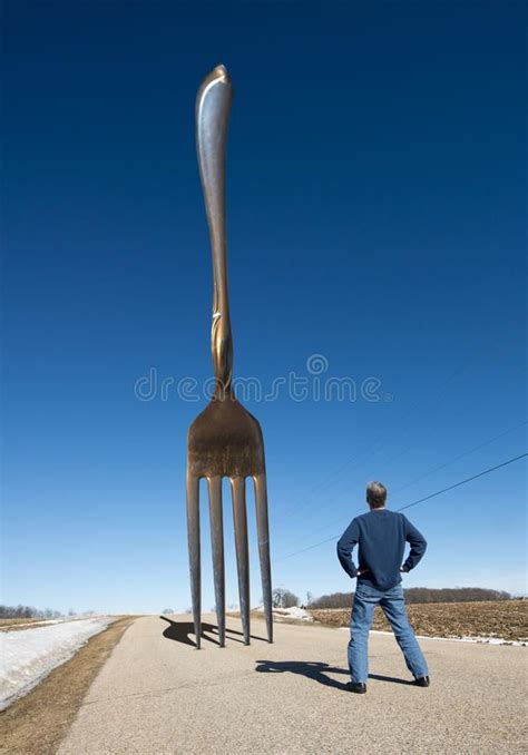 Funny Fork in the Road, Surreal Landscape. A man wonders where to go as ...