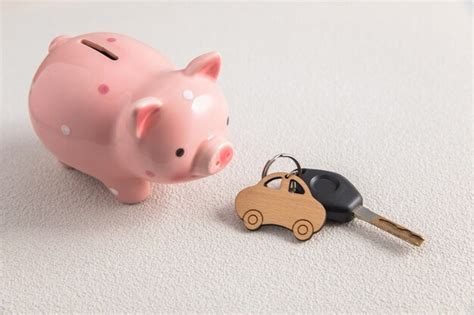 Premium Photo Finance Concept Keys With Car And Piggy Bank