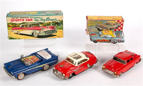 ASSORTED JAPANESE TIN TOY CARS, LOT OF FOUR