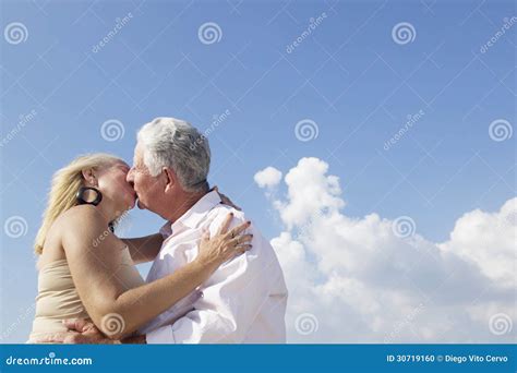 Active Retired People Romantic Elderly Couple In Love And Kissing