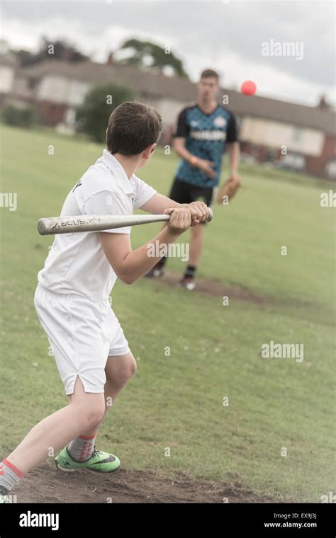 School Students Play Baseball Rounders During Physical Education