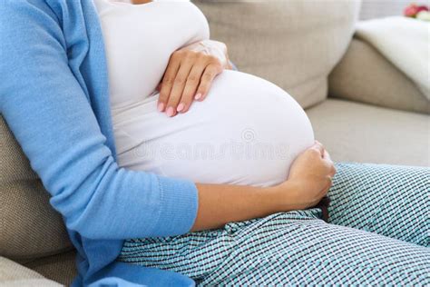 Future Mother Sitting On Sofa Relaxing Touching Tender Her Bell Stock