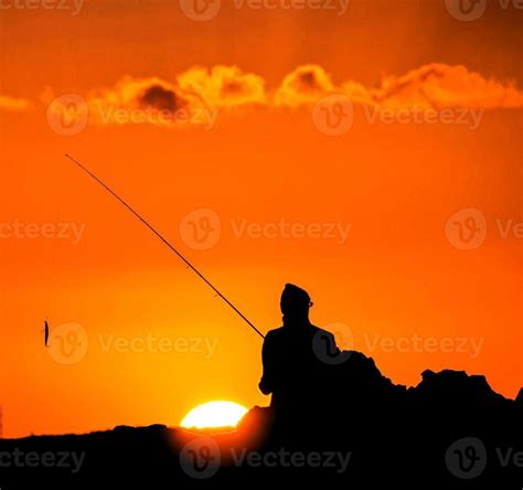 Fishing at sunset 22207261 Stock Photo at Vecteezy