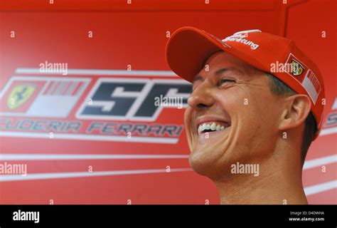 Former F1 world champion German Michael Schumacher laughs during a ...