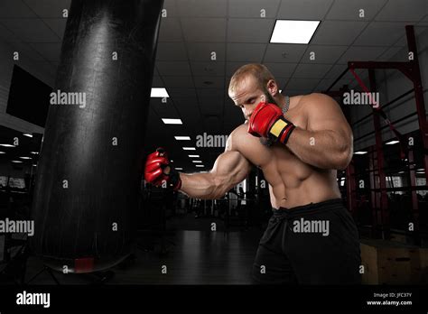 Strong Muscular Man Boxing At The Gym Stock Photo Alamy