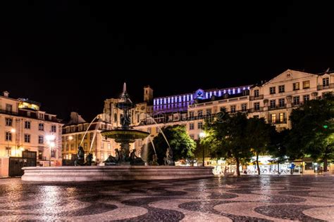 Rossio Square South Fountain with Illuminated Building in the ...