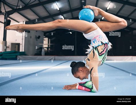 Woman Gymnastics And Ball For Flexible Performance Body Balance And