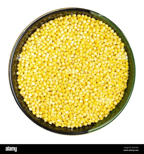 Top View Of Polished Proso Millet In Round Bowl Isolated On White