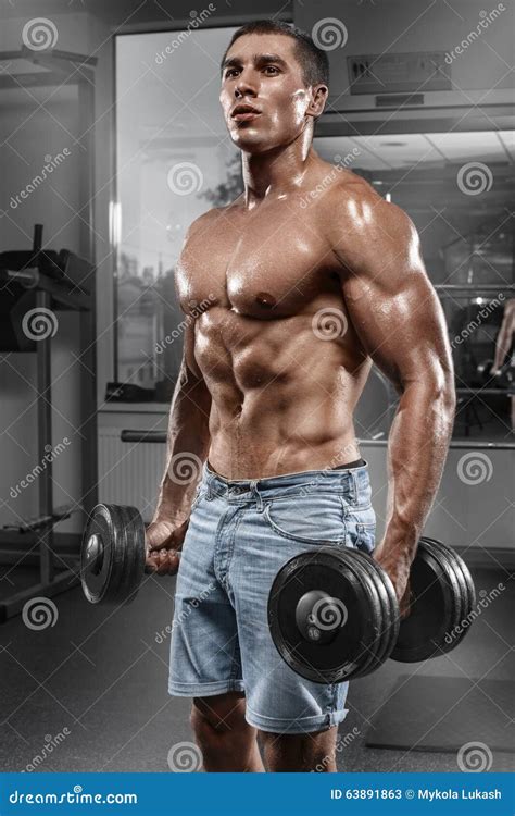 Muscular Man Working Out In Gym Doing Exercises With Barbell Strong Male Naked Torso Abs Stock
