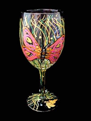 A Wine Glass With A Colorful Butterfly Painted On It S Side And Stem Splays