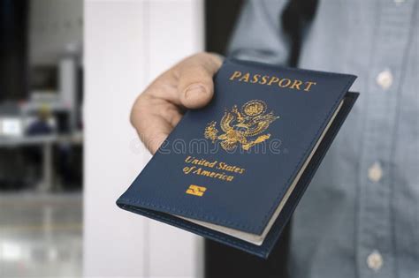 Hand Holding Passport With Bokeh Background Jorney And Travel Concept