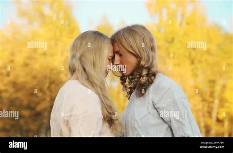 Portrait Of Happy Two Women Smiling Mature Mother And Adult Daughter Hugging In Autumn Park