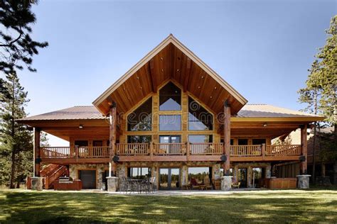 The Exterior of a Modern Log Home with View Windows Stock Photo - Image ...