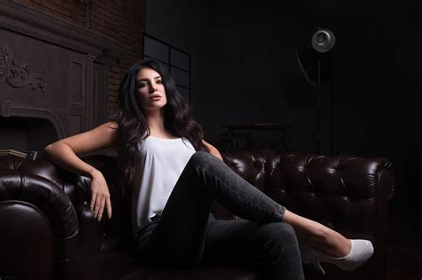 Couch High Heels White Tops Jeans Curly Hair Brunette Long Hair Blue Eyes Wavy Hair