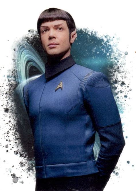 a man in a blue star trek uniform with his hands on his hips and ...