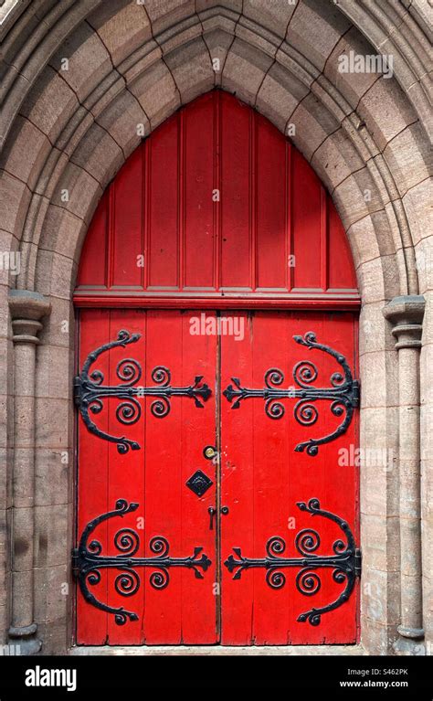 Red Church Door With Elaborate Iron Hinges Stock Photo Alamy