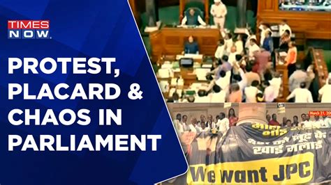 Protest Placard And Chaos In Parliament Nda Slams Rahul Gandhi For