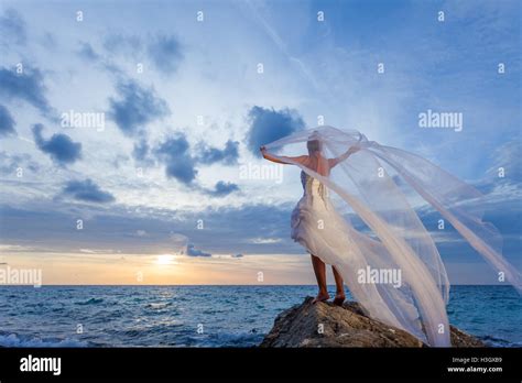 Beautiful Bride On The Beach At Sunset Stock Photo Alamy