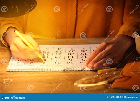 Woman Marking Date In Calendar At Wooden Table Stock Image Image Of