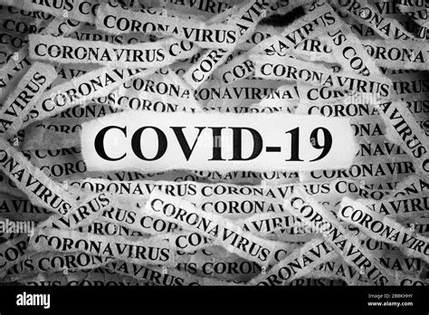 Strips Of Newspaper With The Words Covid 19 And Coronavirus Typed On