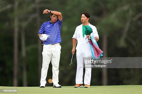 Hideki Matsuyama Of Japan Talks With His Caddie On The 18th Green